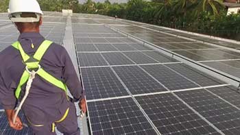 Worker On Solar Roof-25628392